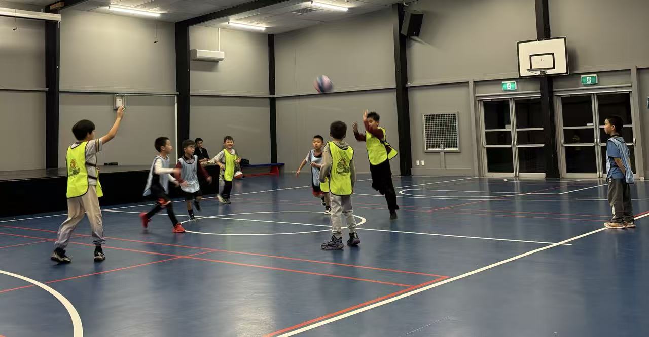 Kids in training bibs playing a scrimmage